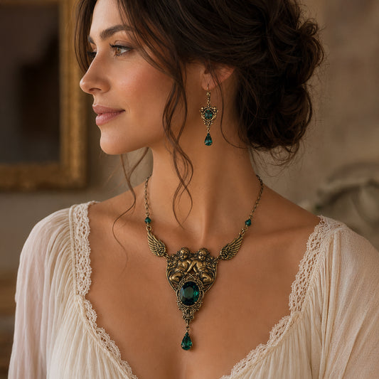 Vintage brass emerald cherub necklace and earring set worn by a woman.