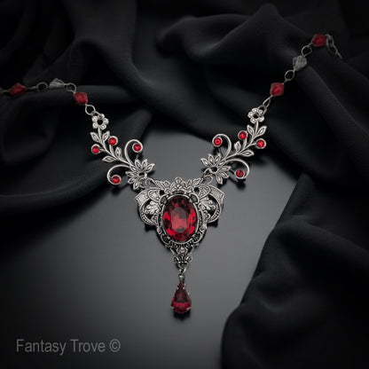 A red Swarovski crystal necklace with intricate vintage floral design.  Fairycore Vampire Jewelry Aesthetic.