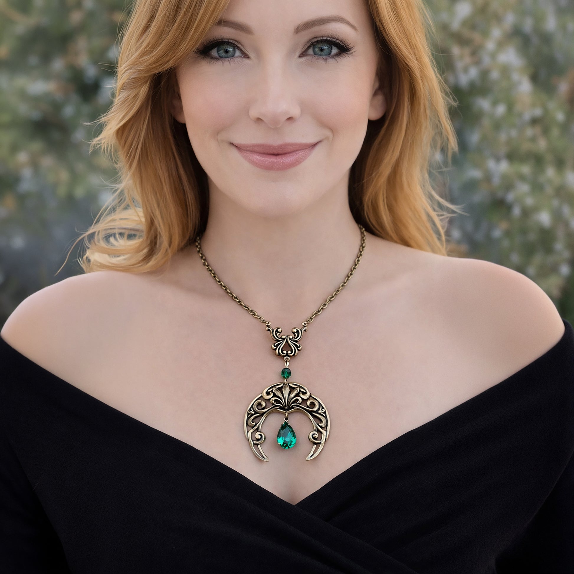 Vintage Gothic Emerald Swarovski Crystal Crescent Moon celestial pendant Necklace displayed on a model