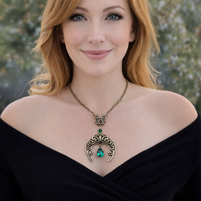 Vintage Gothic Emerald Swarovski Crystal Crescent Moon celestial pendant Necklace displayed on a model