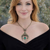 Vintage Gothic Emerald Swarovski Crystal Crescent Moon celestial pendant Necklace displayed on a model