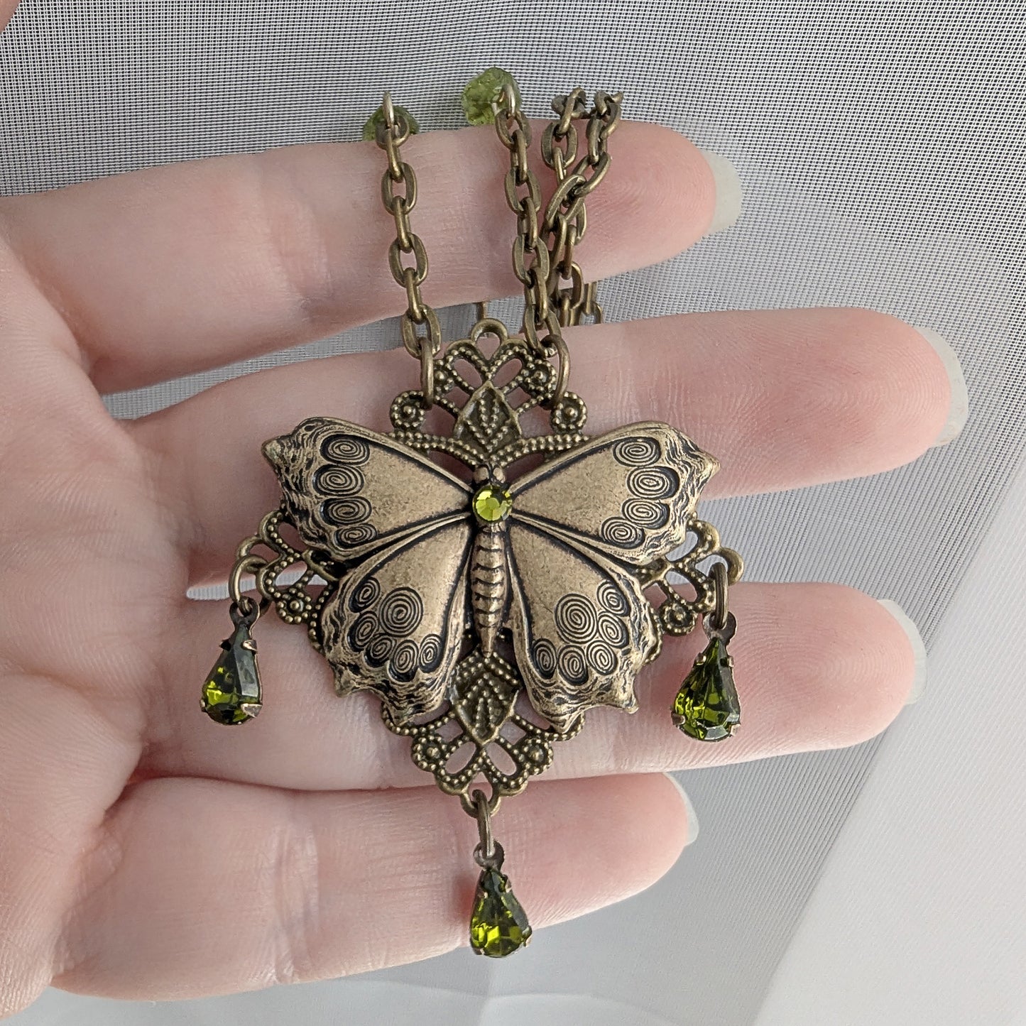 Brass Vintage Cottagecore Butterfly necklace with olivine gemstones