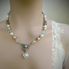 vintage Pearl and crystal necklace on a bride with a blurred background