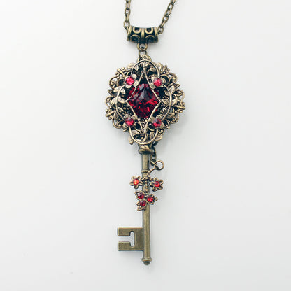 Vintage Elven floral bronze fantasy key necklace made with Scarlet Swarovski crystals.  Fantasy jewelry.  Magical Jewelry.