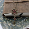 Vintage Elven floral bronze fantasy key necklace made with Scarlet Swarovski crystals.  Fantasy jewelry.  Magical Jewelry.