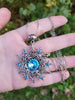 Sterling Silver Snowflake necklace and earring set made with aquamarine Swarovski crystals.