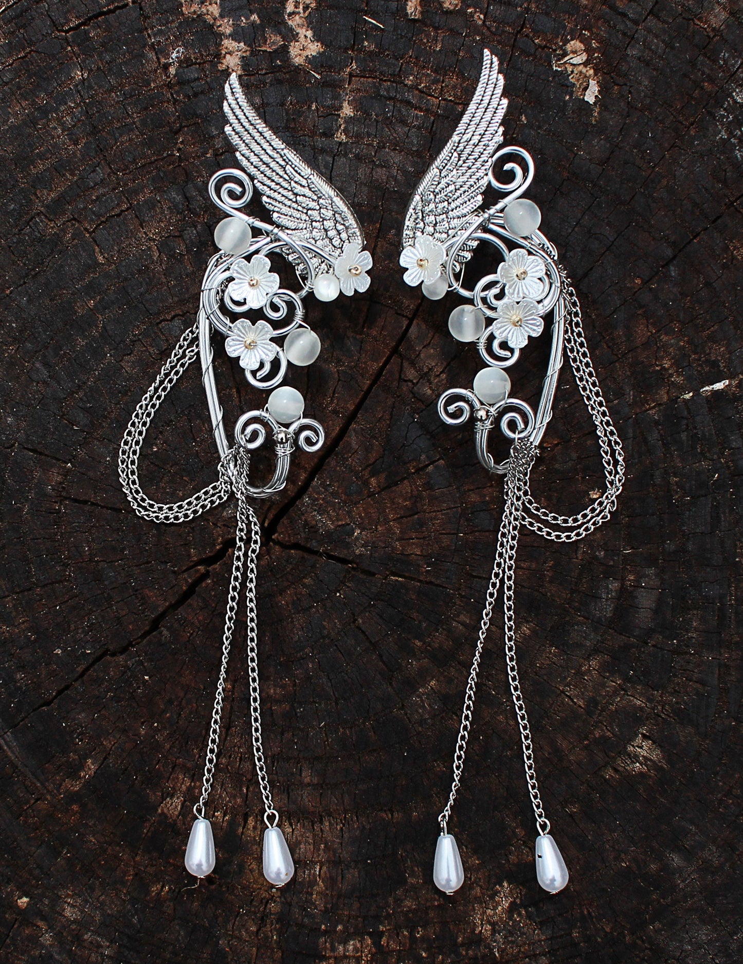 Elf fantasy ear cuffs with flowers and shoulder-length chains.  Elven jewelry.