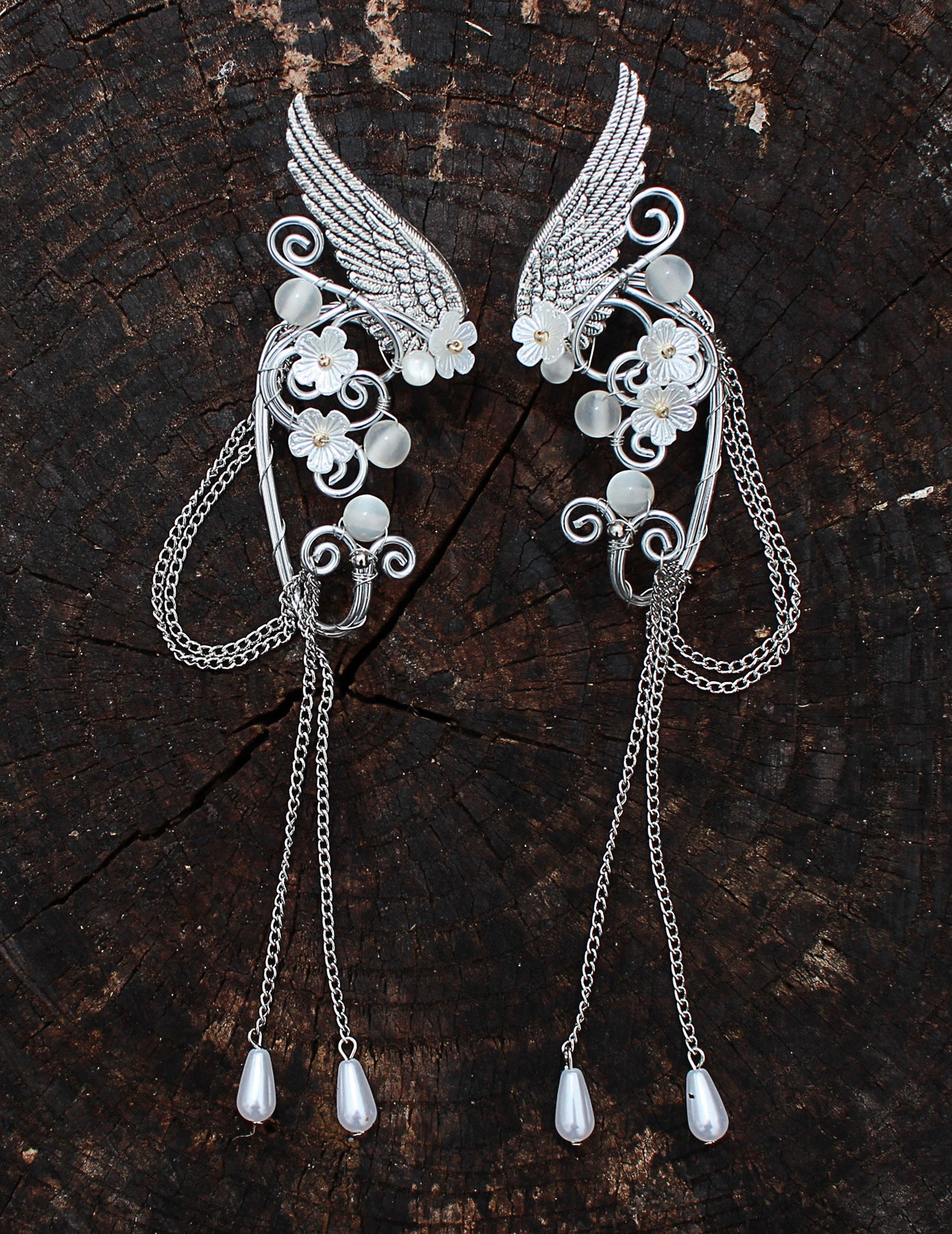 Elf fantasy ear cuffs with flowers and shoulder-length chains.  Elven jewelry.
