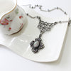 Unique Silver Celtic Styled Gothic Necklace with Mystic Stone and purple crystals