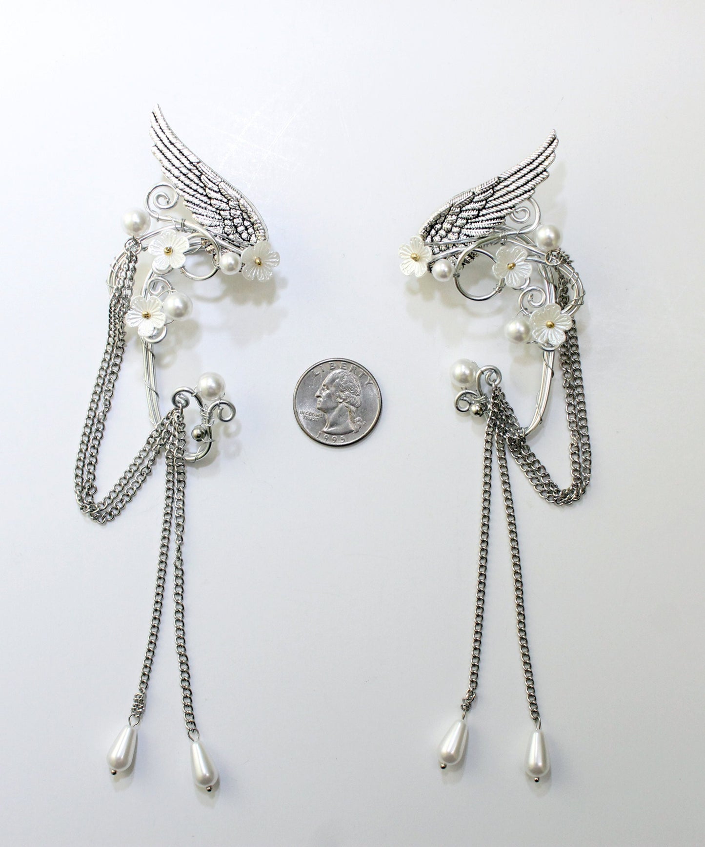 Elf fantasy ear cuffs with flowers and shoulder-length chains.  Elven jewelry.