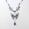 Vintage floral Silver butterfly pendant necklace with Swarovski rhinestones and a blue baroque Maple leaf shaped drop crystal.