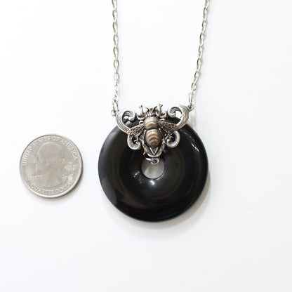 Black onyx donut stone necklace with bumble bee.  Bumblebee jewelry gift.