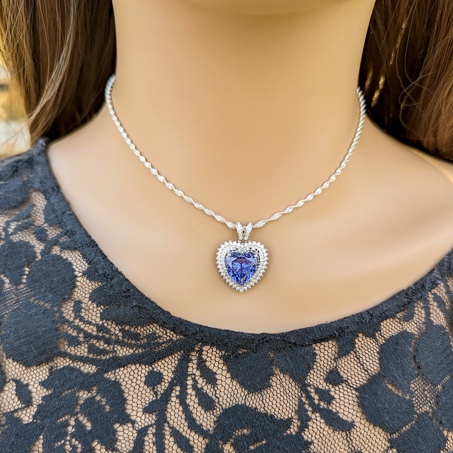 Sterling Silver Tanzanite Heart Necklace with Cubic Zirconia Stones.