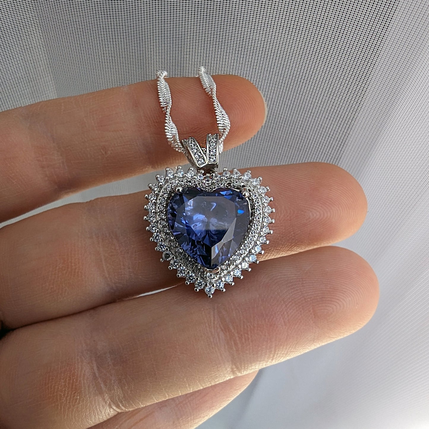Sterling Silver Tanzanite Heart Necklace with Cubic Zirconia Stones.