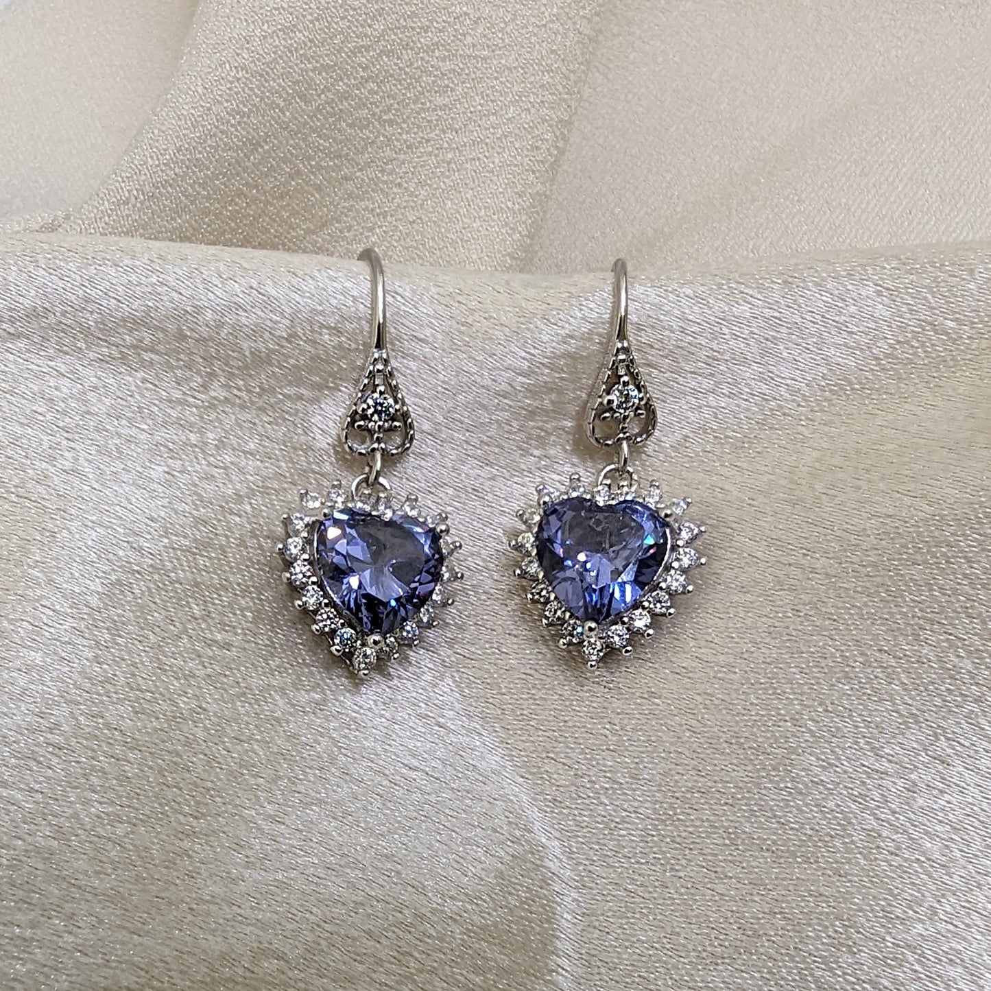 Sterling Silver Tanzanite Heart Earrings with Cubic Zirconia Stones.
