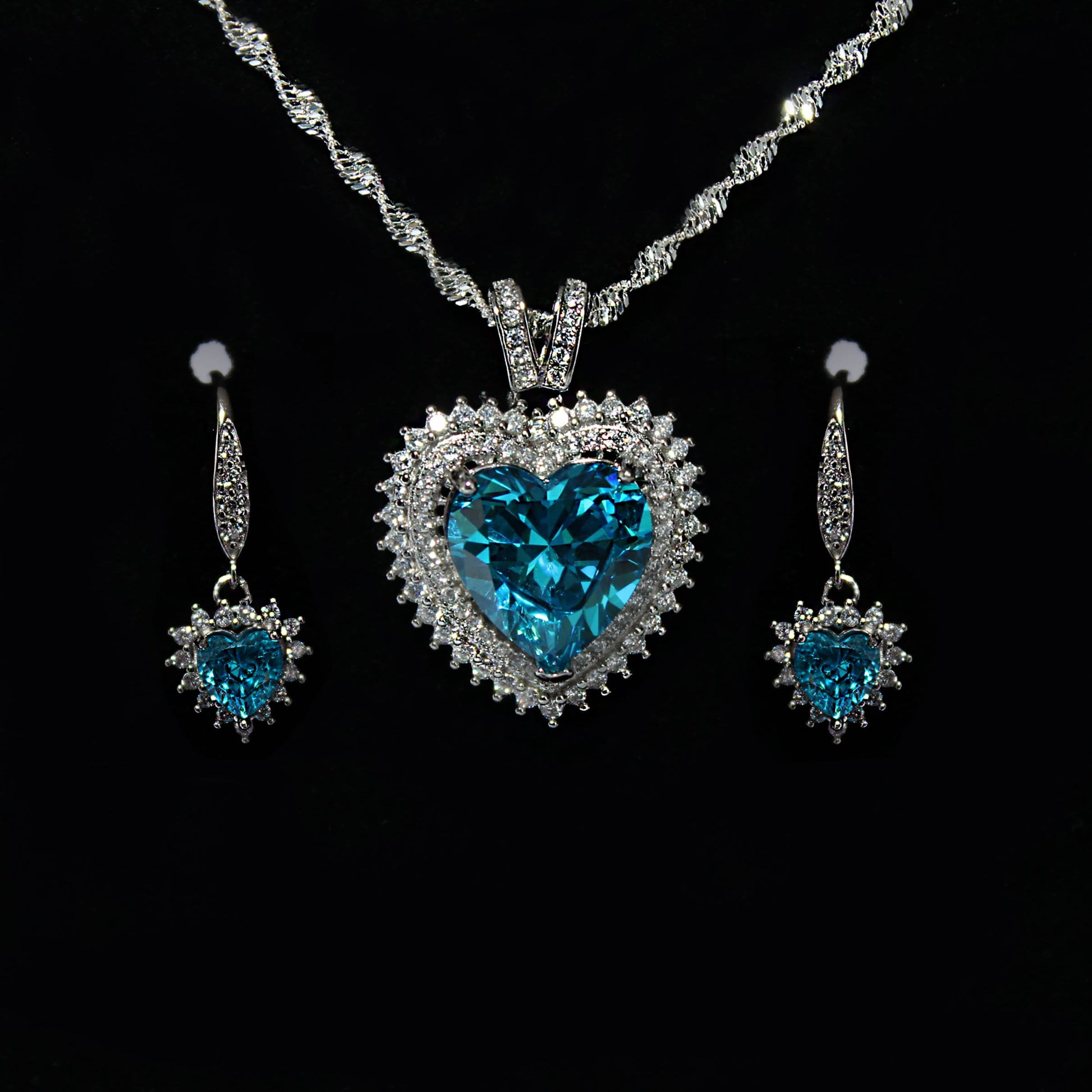 925 Sterling Silver Blue Topaz Cubic Zirconia Heart Pendant Necklace and Earring set.