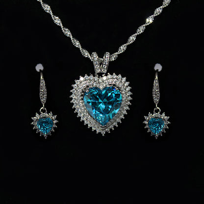 925 Sterling Silver Blue Topaz Cubic Zirconia Heart Pendant Necklace and Earring set.