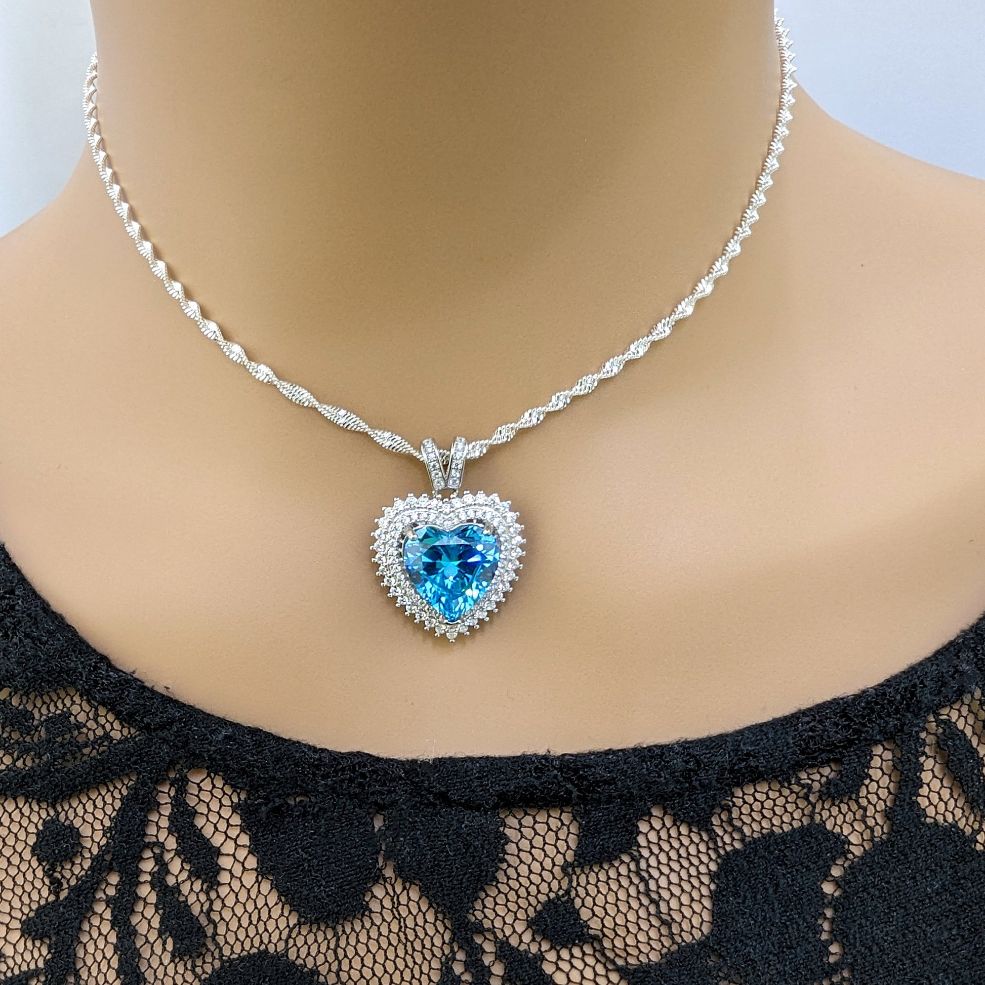 925 Sterling Silver Blue Topaz Cubic Zirconia Heart Pendant Necklace.