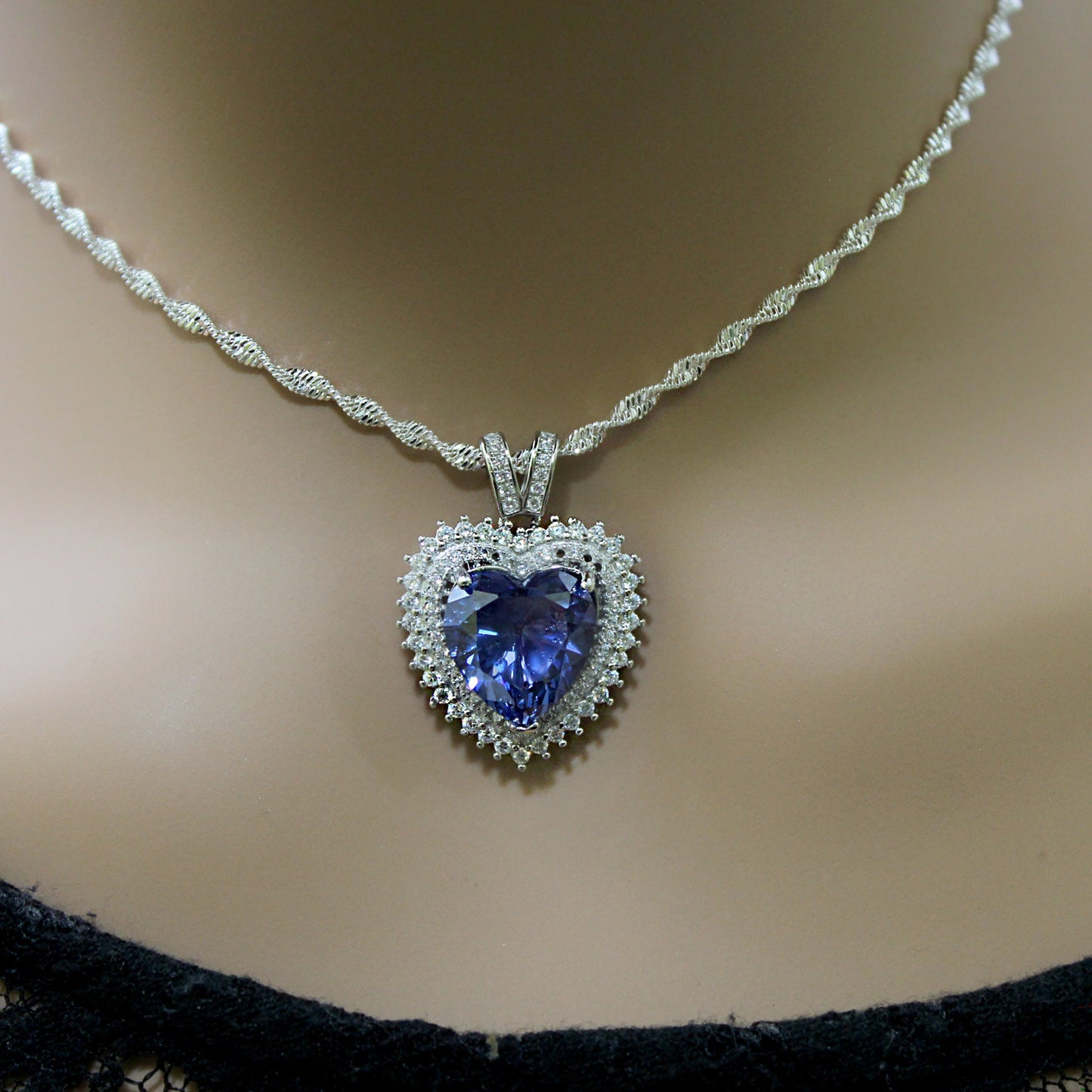 Sterling Silver Tanzanite Heart Necklace with Cubic Zirconia Stones.