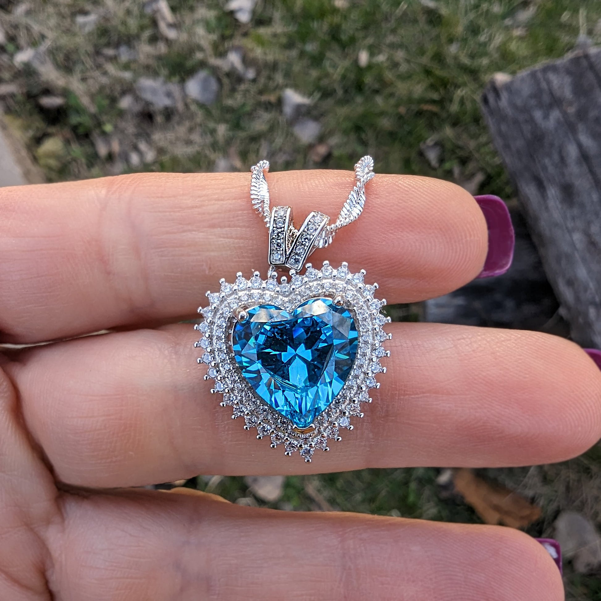 925 Sterling Silver Blue Topaz Cubic Zirconia Heart Pendant Necklace.